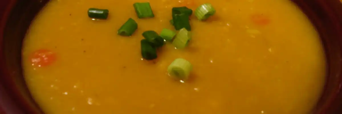 A bowl of French-Canadian yellow split pea soup with scallions